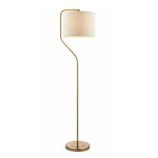 Floor lamp with gold base and white shade on a white background
