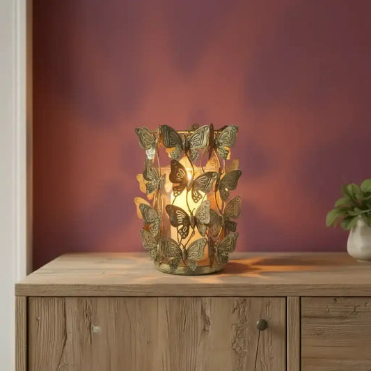 Decorative butterfly lamp on a wooden cabinet with a warm glow against a blurred background