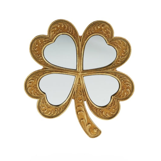 Decorative mirror shaped like a four-leaf clover with gold leaf design on a white background