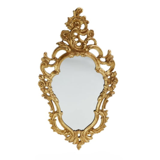 Decorative gold mirror with intricate designs on a white background