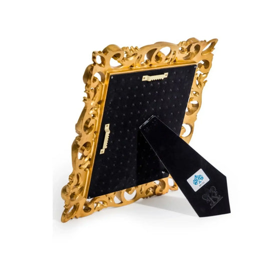 Gold decorative frame with a black tie on a white background
