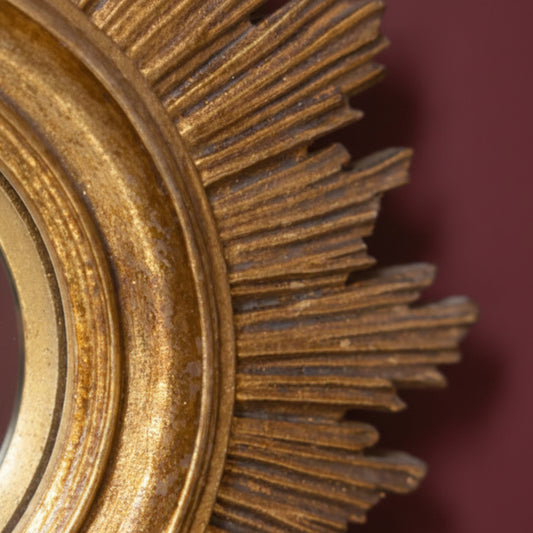 Close-up of a rusty metal gear on a dark background