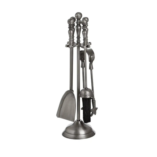Set of four metal fireplace tools on a white background