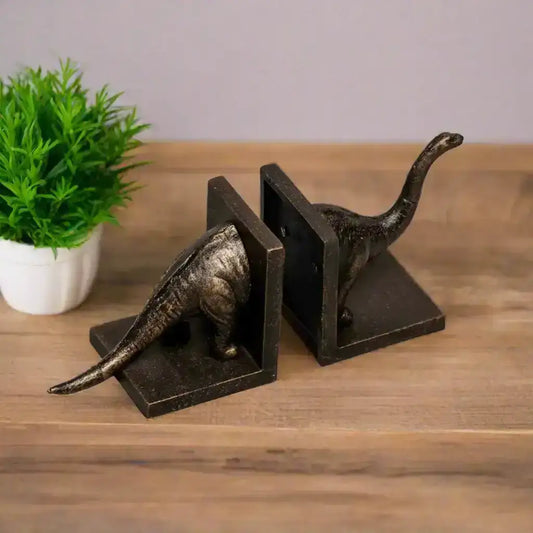 Bronze dinosaur bookends on a white background