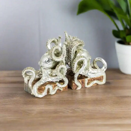 Silver octopus-shaped jewelry on a white background