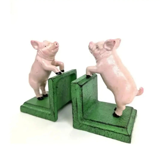 Two pig-shaped bookends on a white background