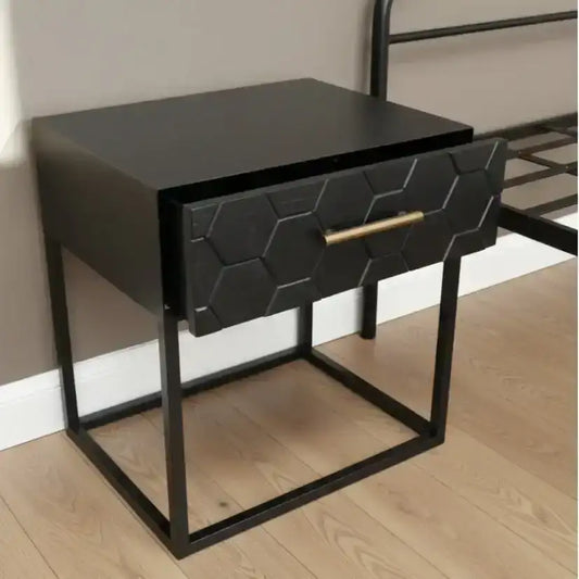 Black hexagonal patterned drawer on a gray textured surface