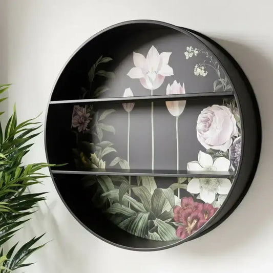 Round decorative shelf with floral design on a white wall