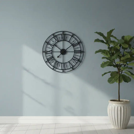 Decorative wall clock on a light blue wall with a potted plant below.