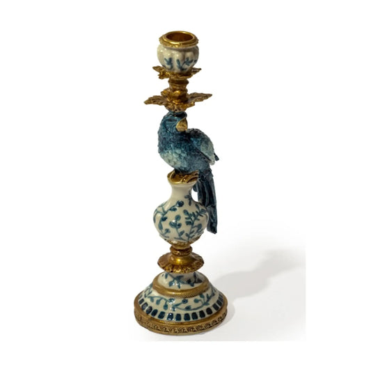 Decorative candle holder with bird design on a white background