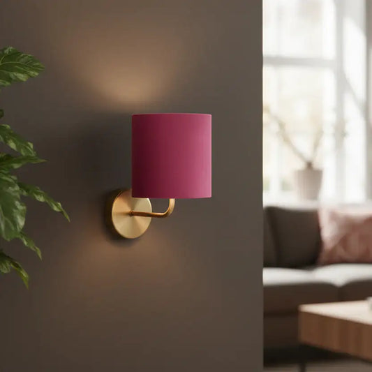Wall-mounted lamp with a pink shade in a living room setting