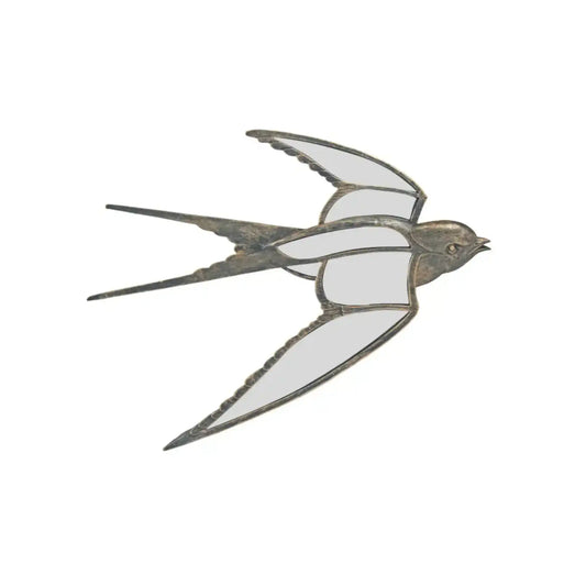 Decorative metal swallow sculpture on a white background