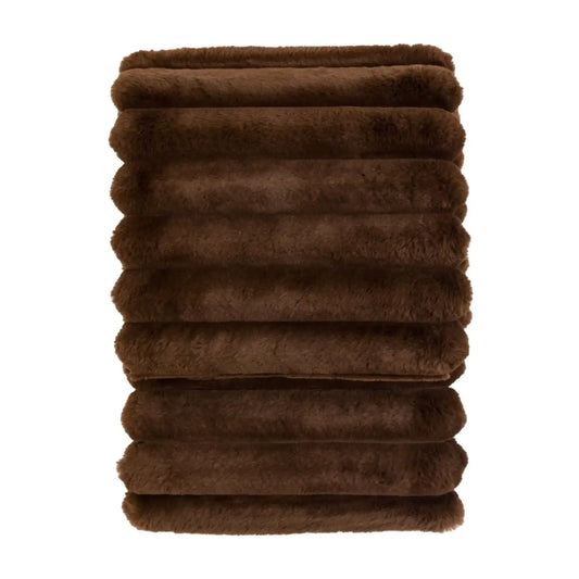 Stack of brown towels on a white background