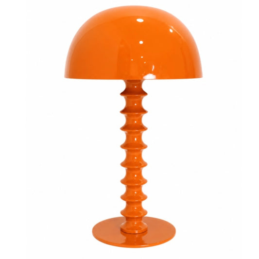 Orange table lamp with a textured base on a white background