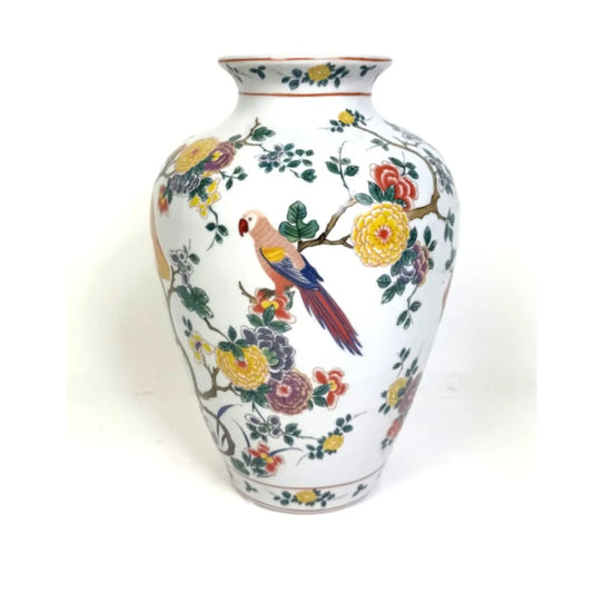 Decorative vase with floral and parrot design on a white background