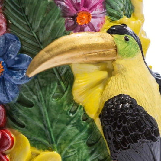 Decorative item with a toucan and floral elements