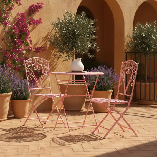 Pink outdoor furniture set with decorative elements on a patio.