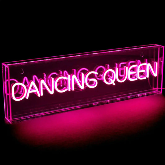 Neon sign with 'Dancing Queen' text on a black background