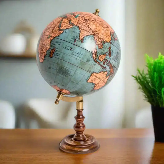 Vintage-style globe on a stand with a detailed map of the world.