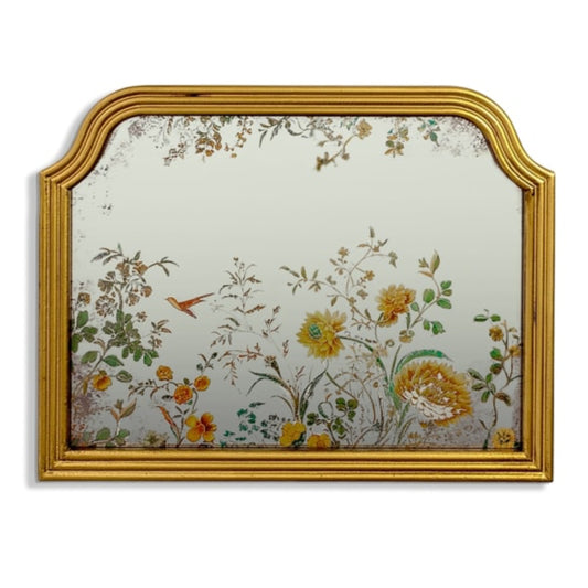 Decorative mirror with floral design and gold frame on a white background
