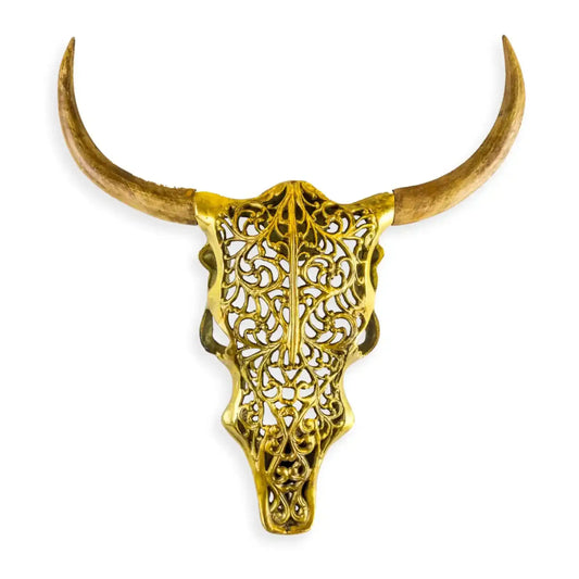Decorative gold bull skull with long horns on a white background