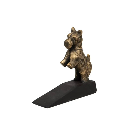 Bronze dog-shaped door stopper on a white background