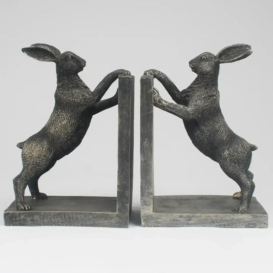 Pair of bronze rabbit bookends on a white background