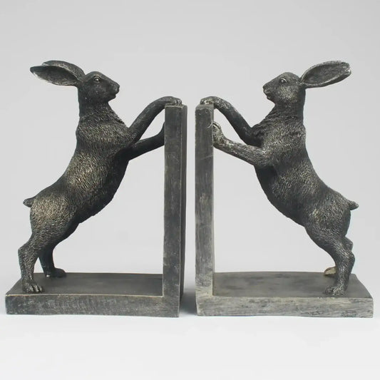 Pair of bronze rabbit bookends on a white background