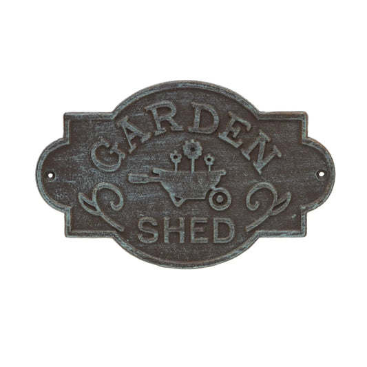Decorative metal sign with 'Garden Shed' text and a wheelbarrow illustration on a white background.