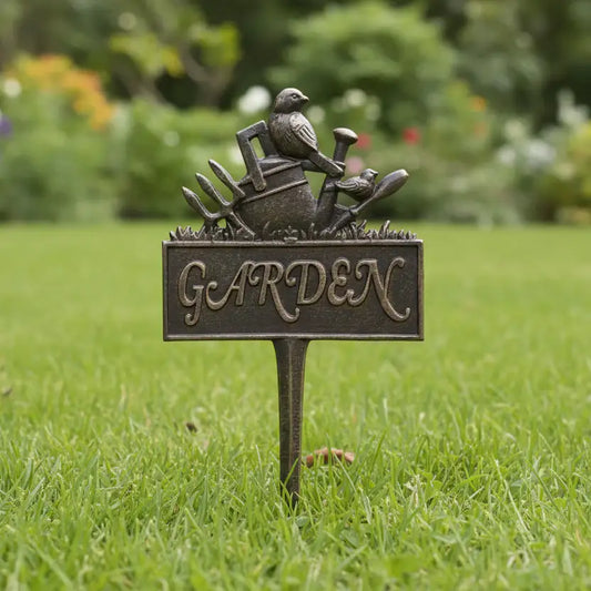 Garden-themed decorative sign with a bird and tools on a grassy background
