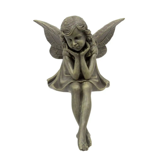 Bronze fairy figurine with wings on a white background