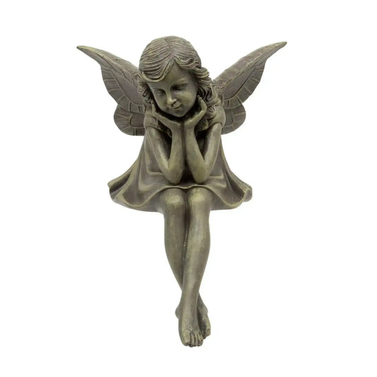 Bronze fairy figurine with wings on a white background