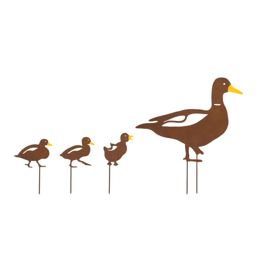 Set of decorative duck figures on stands against a white background