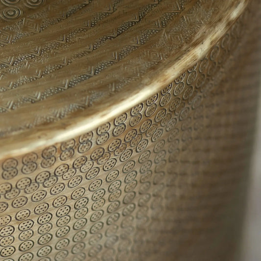 Close-up of a textured metallic surface with intricate patterns