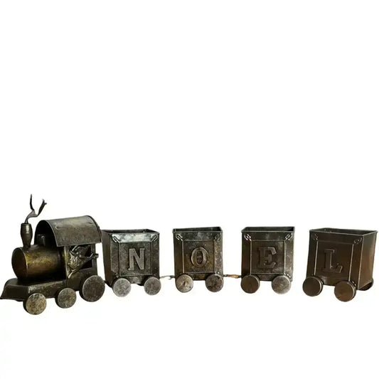 Decorative train set in front of a fireplace with stockings hanging above2