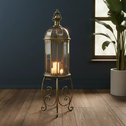 Decorative lantern with candles on a stand in a room with a plant and window.