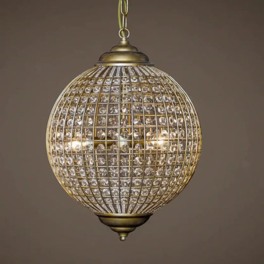 Decorative hanging light fixture with crystal details on a brown background