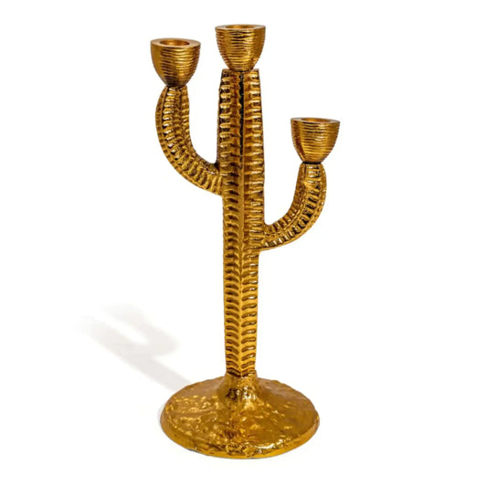 Gold cactus-shaped candle holder on a white background