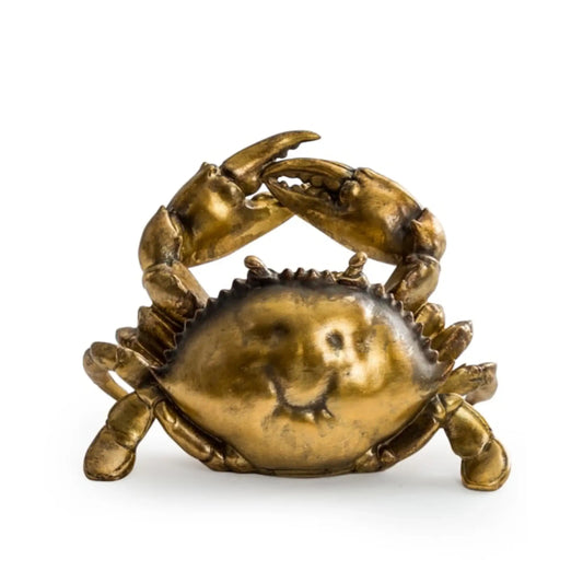 Bronze crab sculpture on a white background