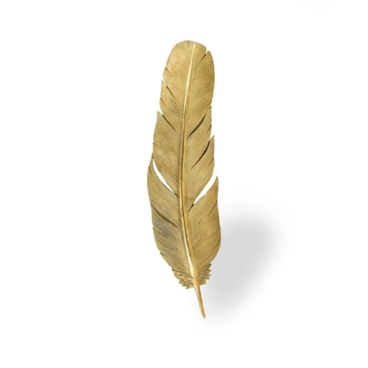 Gold feather on a white background