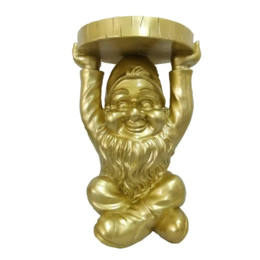 Gold gnome statue holding a round object on a white background
