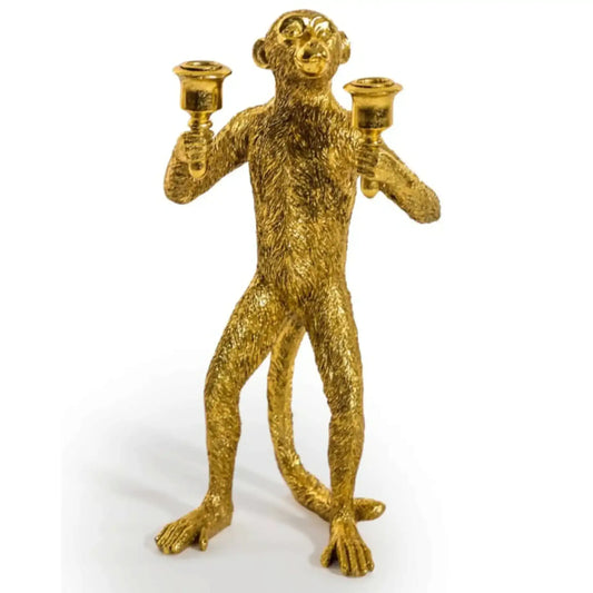 Gold monkey candle holder on a white background