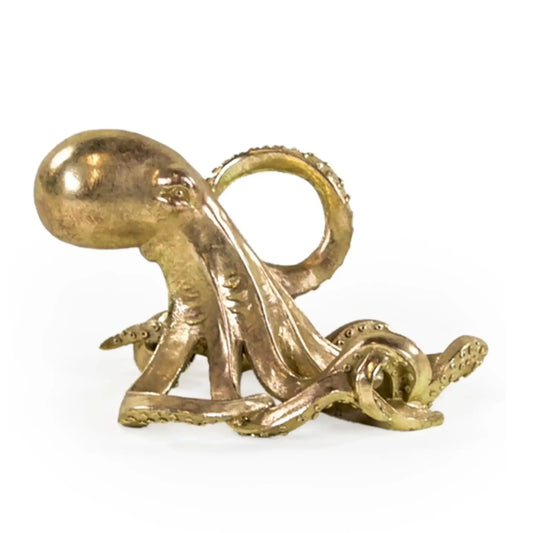Bronze octopus sculpture on a white background