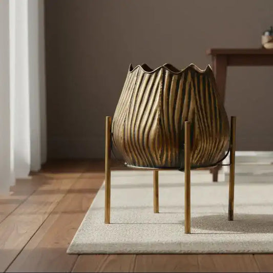 Decorative metal lantern with ribbed design on a black background
