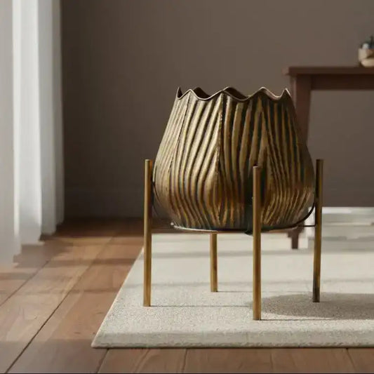 Decorative metal lantern with ribbed design on a black background