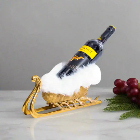 Wine bottle on a decorative gold stand with a white background