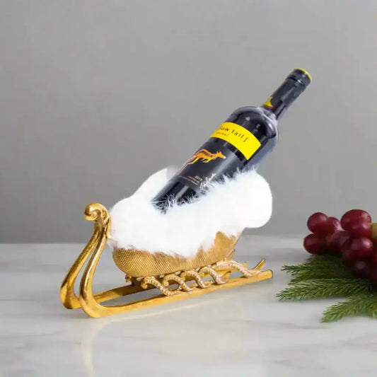 Wine bottle on a decorative gold stand with a white background