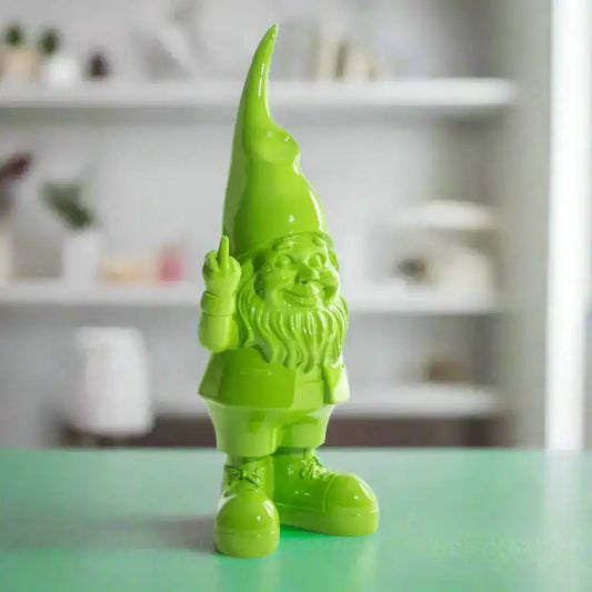 Green garden gnome figurine on a white background