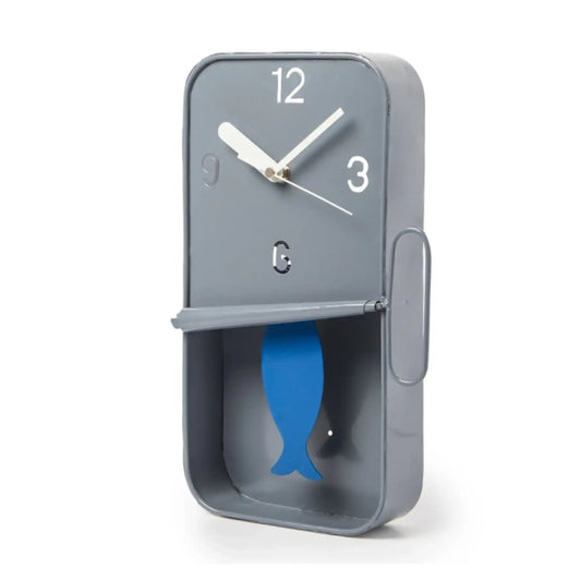 Gray clock with a blue fish design on a white background