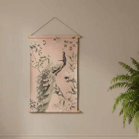 Decorative wall hanging with peacock design on a beige wall.